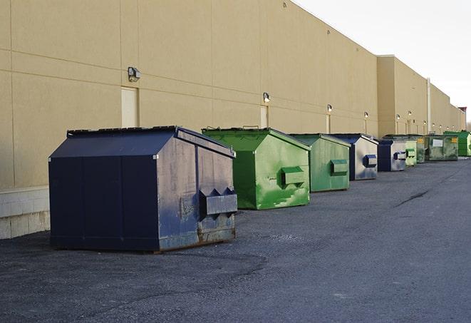 large construction waste containers in a row at a job site in Atlantic Beach, FL